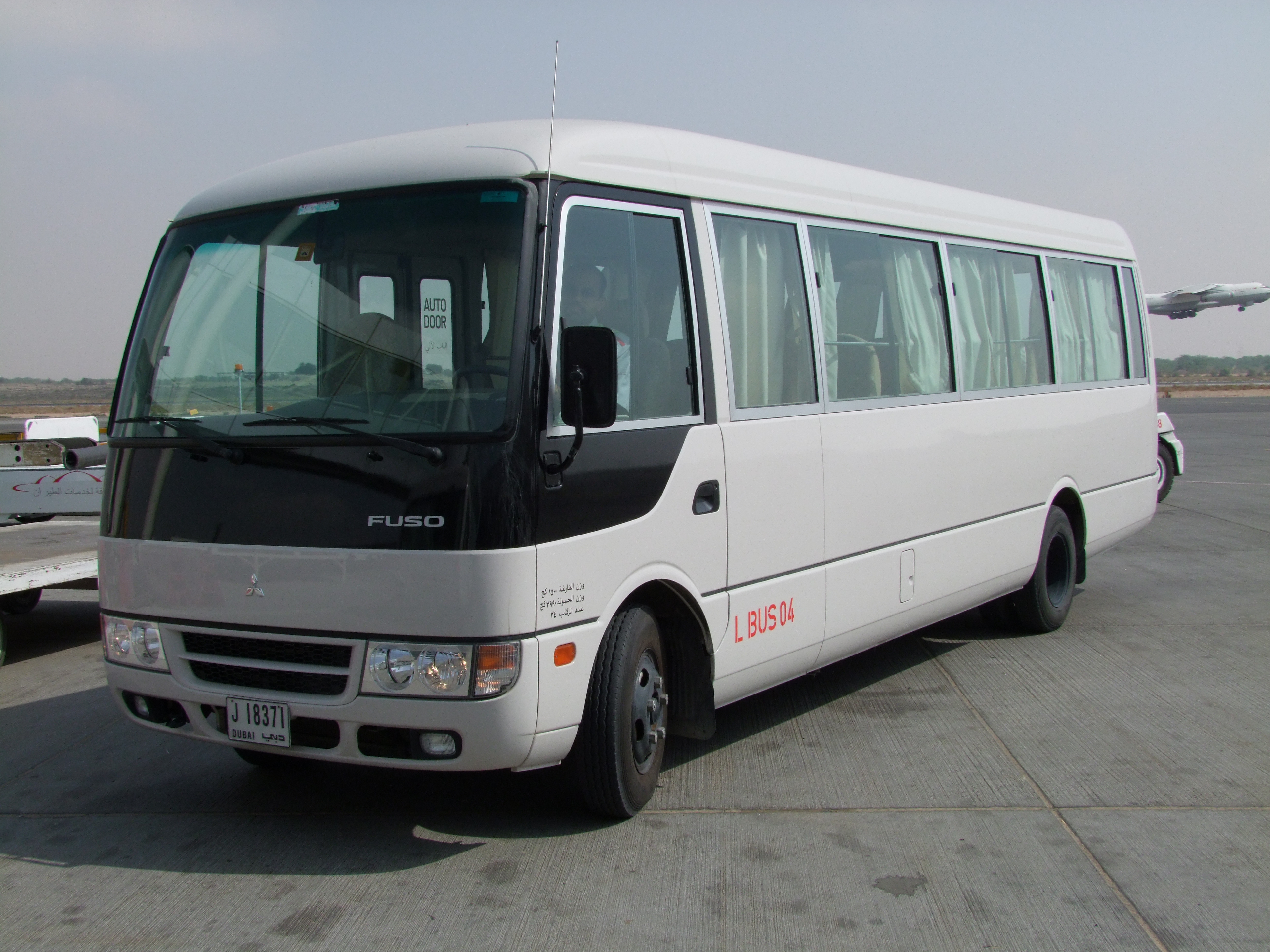 White bus Mitsubishi Rosa